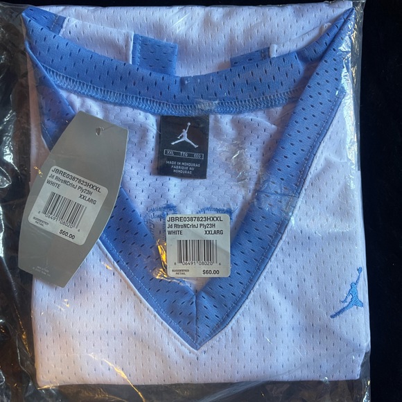 This is an authentic brand new Michael Jordan North Carolina Jumpman jersey. - Picture 2 of 3